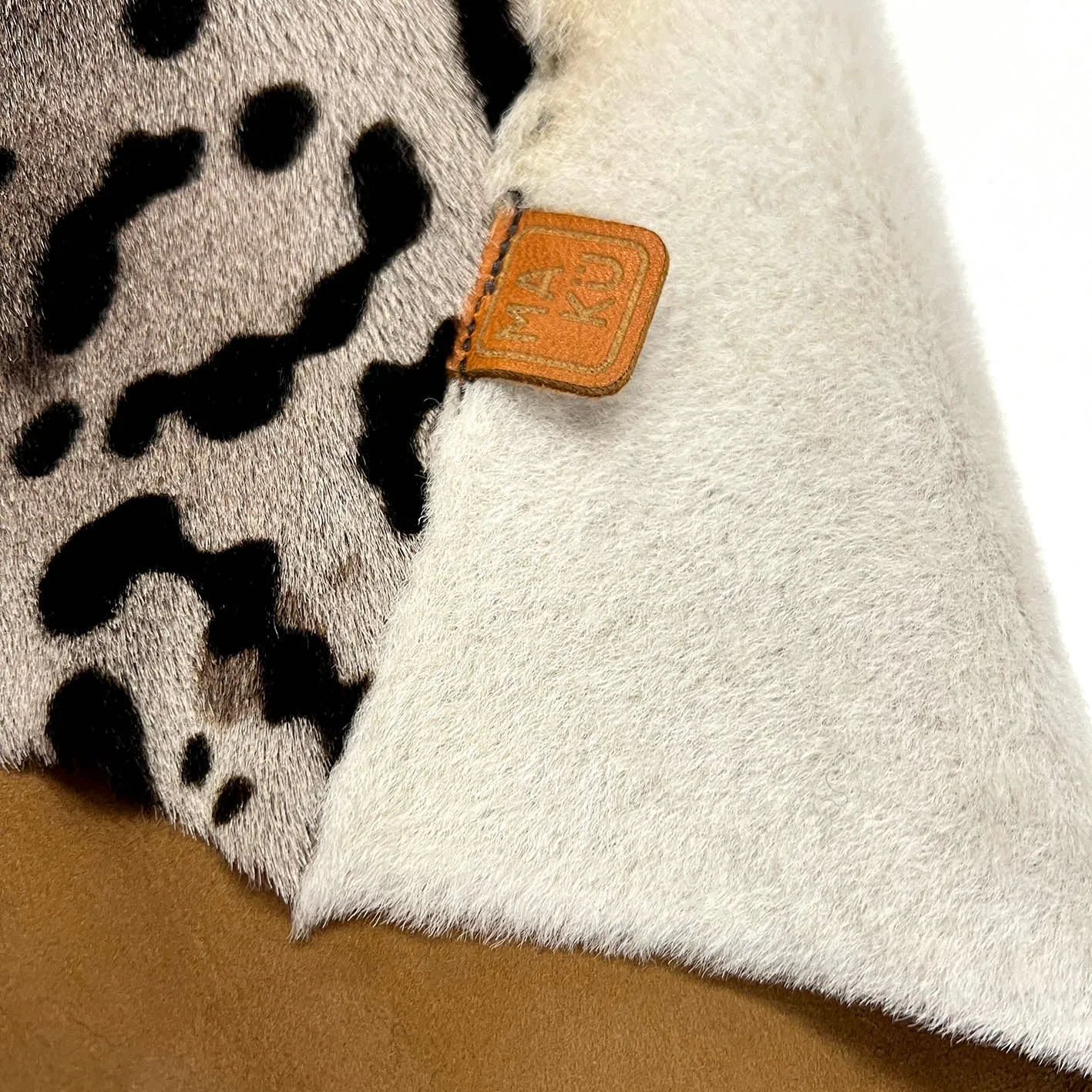 TAIGA Sheepskin Waistcoat - Cappuccino   Black Animal Print / Natural